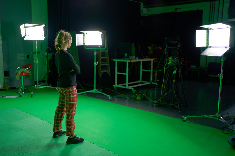 Presenter in front of green screen
